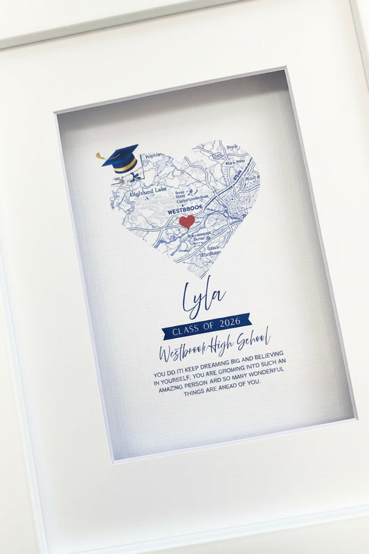 Framed personalized graduation-themed heart-shaped map print with text gift.