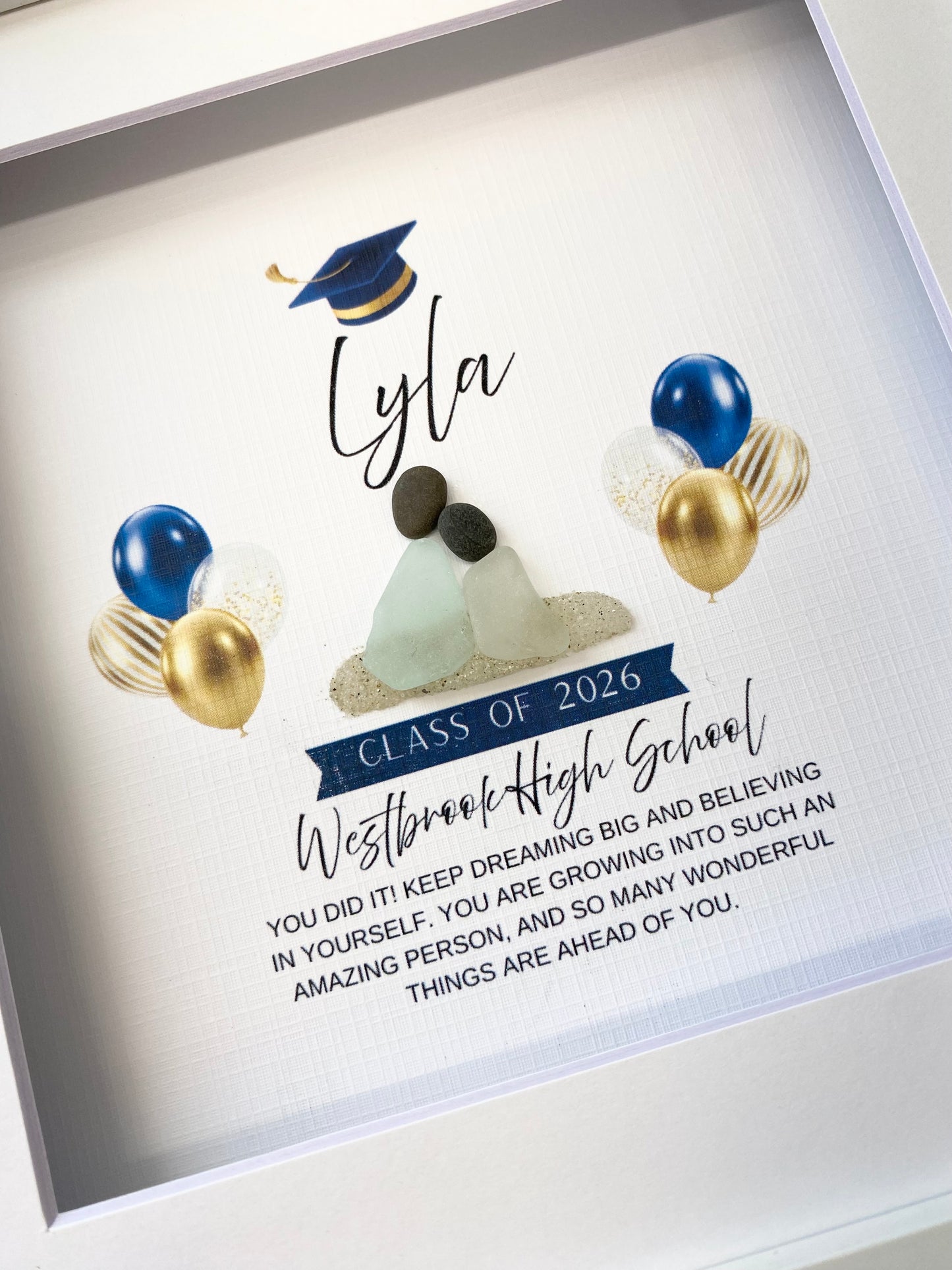 Graduation-themed personalized sea glass art with text and decorative elements on a light background