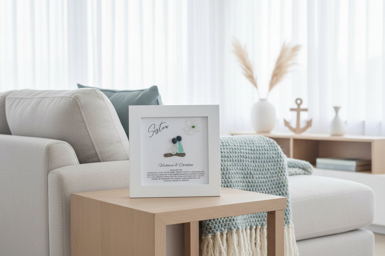Living room with a framed picture on a coffee table, light-colored sofa, and decorative items.