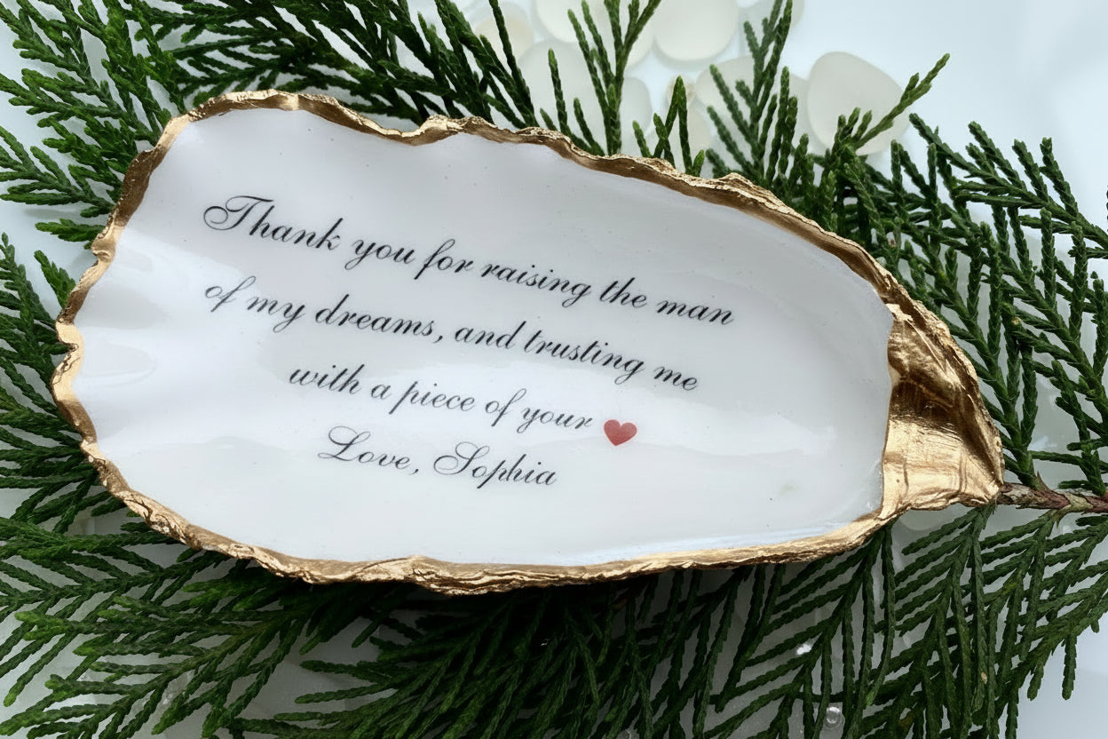 Oyster shell with engraved message on greenery