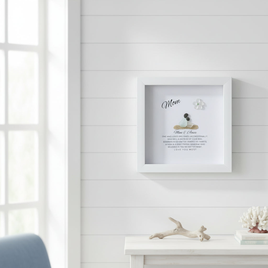 Framed artwork on a white wall with decorative elements