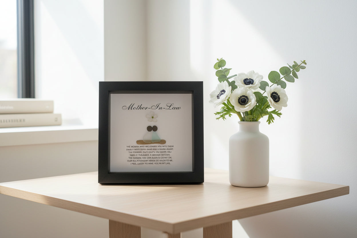 Personalized framed sea glass art for mother-in-law featuring two figures, a small glass flower, names, and custom message in a 9x9 shadow box.